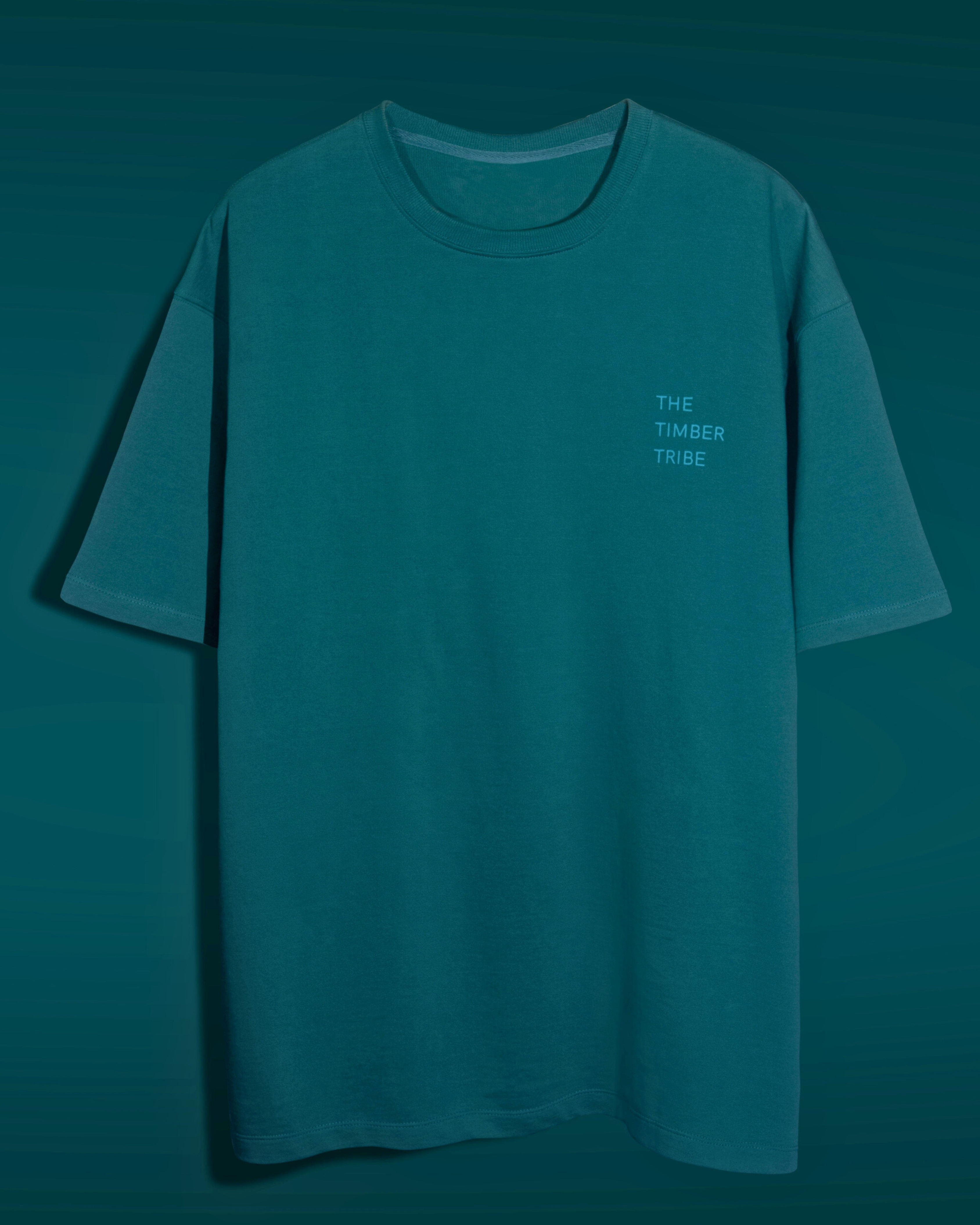 Teal t-shirt with 'The Timber Tribe' logo on a teal background