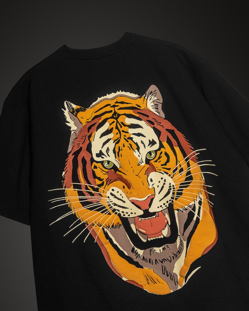 Black t-shirt with a colorful tiger graphic on a dark background