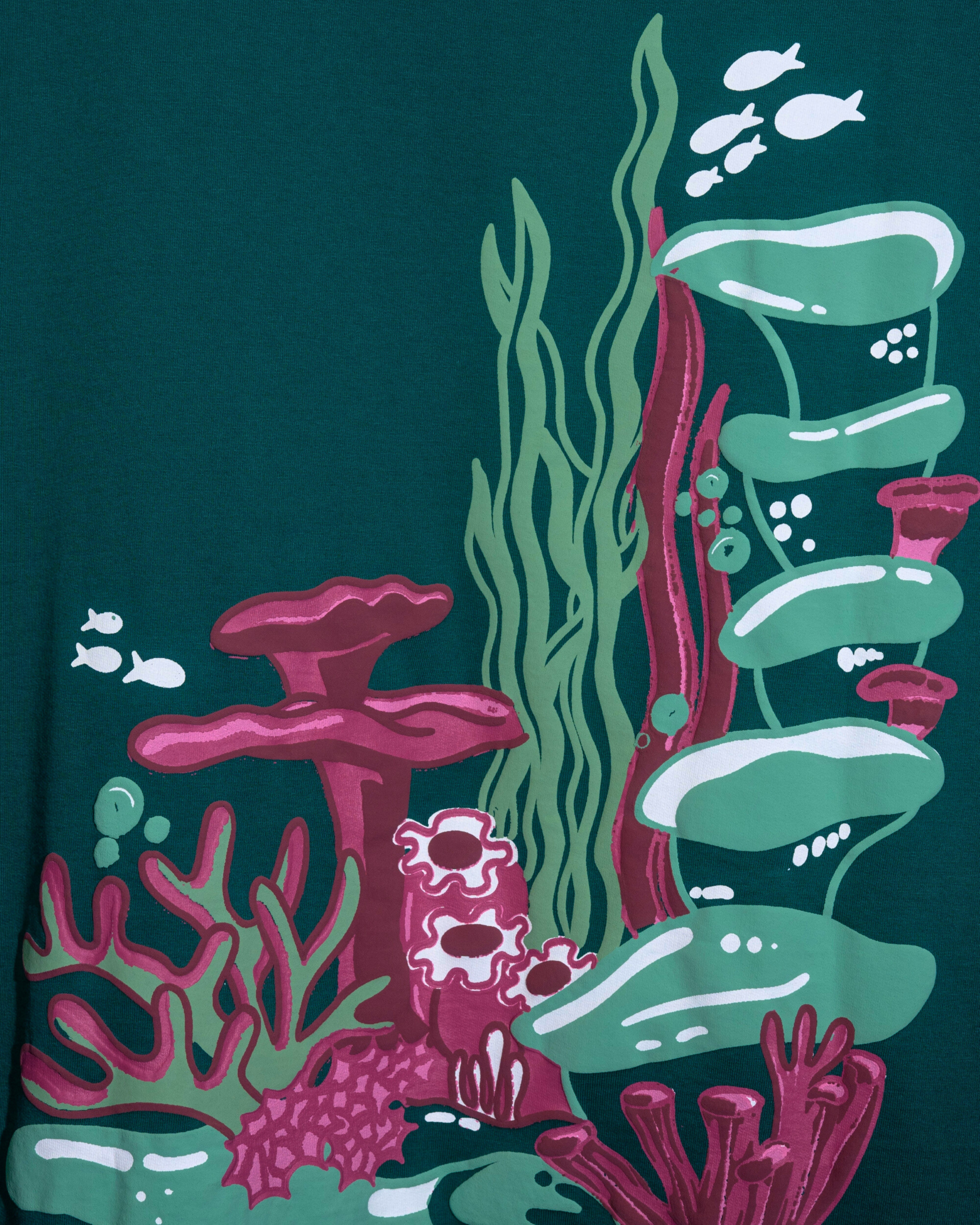 Colorful underwater scene with coral and fish on a dark green background